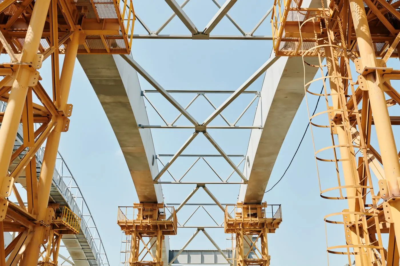 Mobile crane placing a precast bridge girder on a UAE highway project